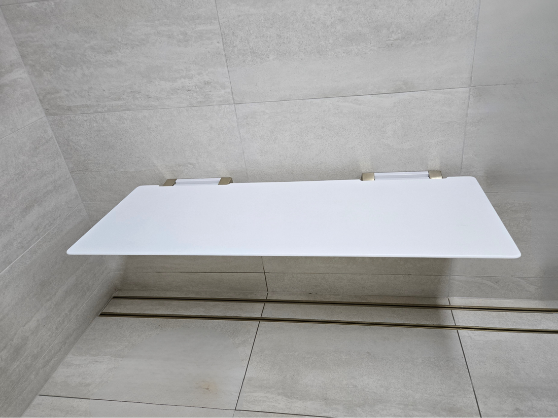 A retrofitted accessible shower with Avail grab rails